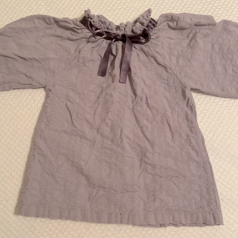 Girl’s gray shirt with bow neck design